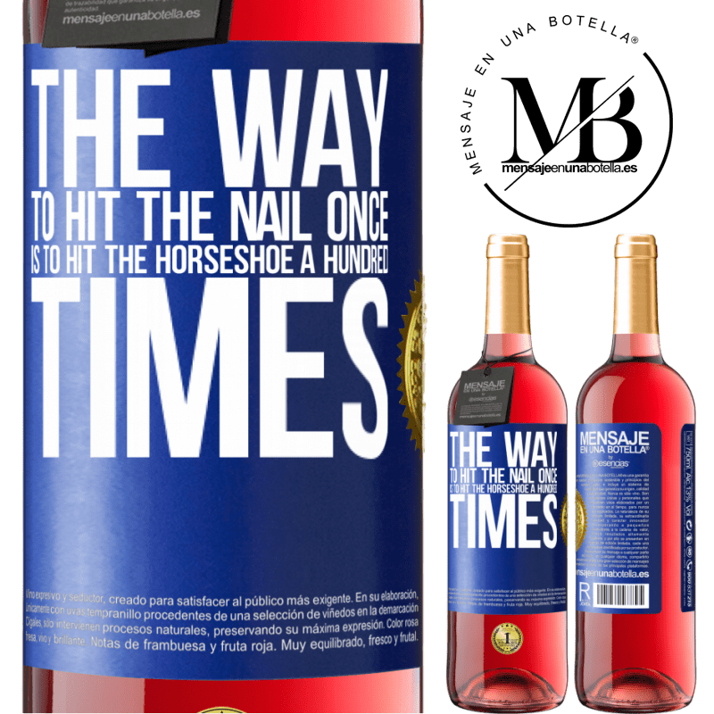 29,95 € Free Shipping | Rosé Wine ROSÉ Edition The way to hit the nail once is to hit the horseshoe a hundred times Blue Label. Customizable label Young wine Harvest 2023 Tempranillo