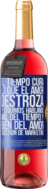 Envío gratis | Vino Rosado Edición ROSÉ El tiempo cura lo que el amor destroza. Y seguimos hablando mal del tiempo y bien del amor. Cuestión de márketing Etiqueta Azul. Etiqueta personalizable Vino joven Cosecha 2023 Tempranillo